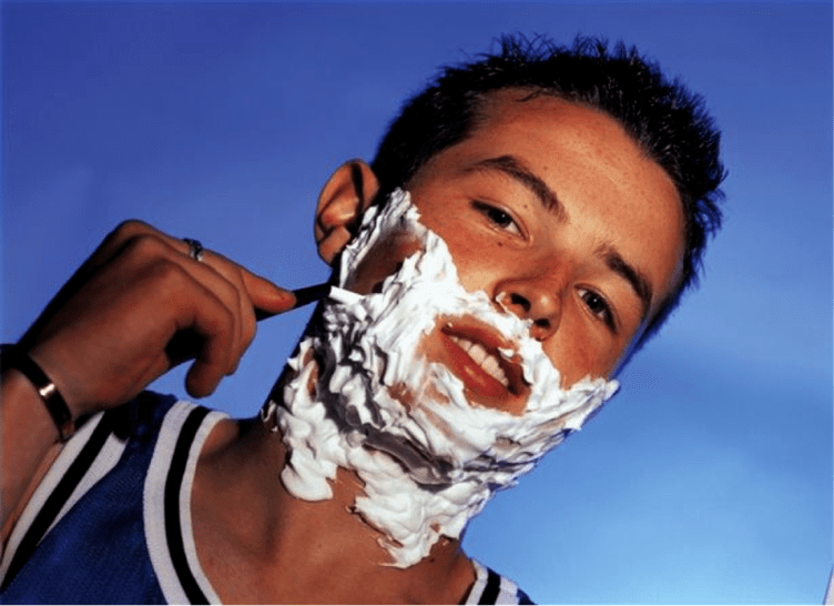 teenager shaving and thinking about penis enlargement