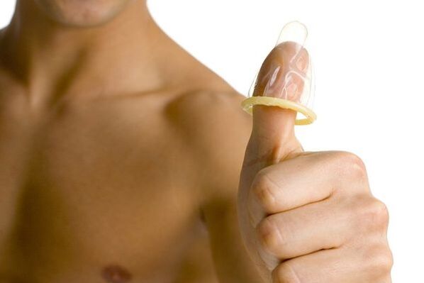 the condom on the finger symbolizes the enlargement of the teenager’s penis
